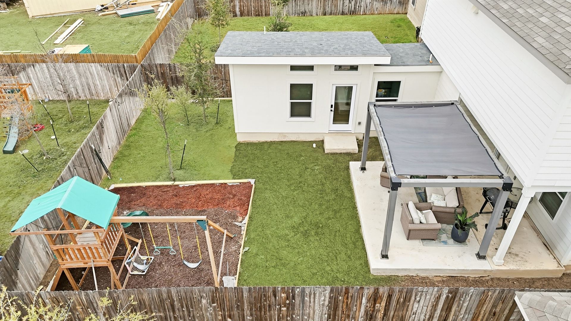 Aerial view of yard with pergola