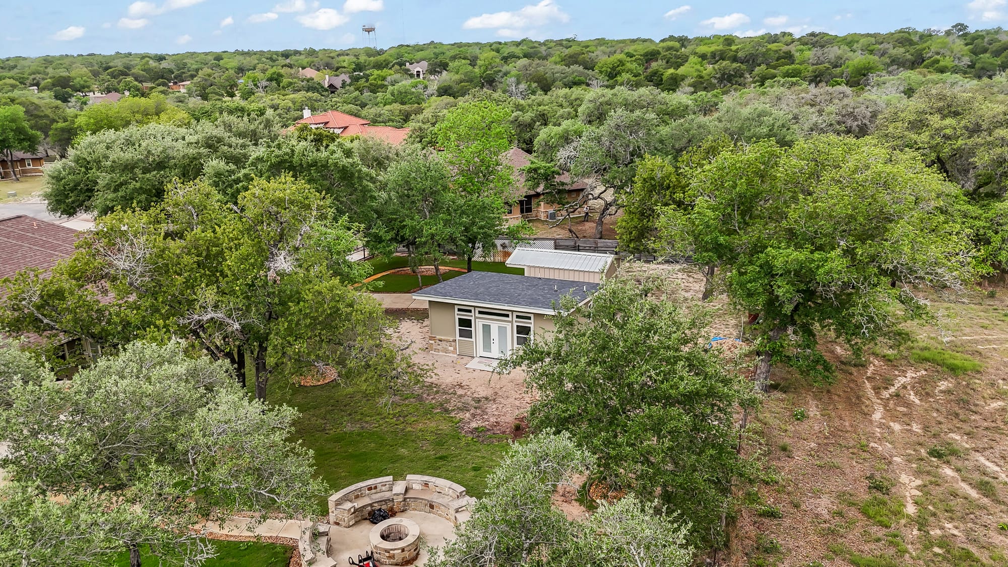 Aerial wide view of the property and neighborhood