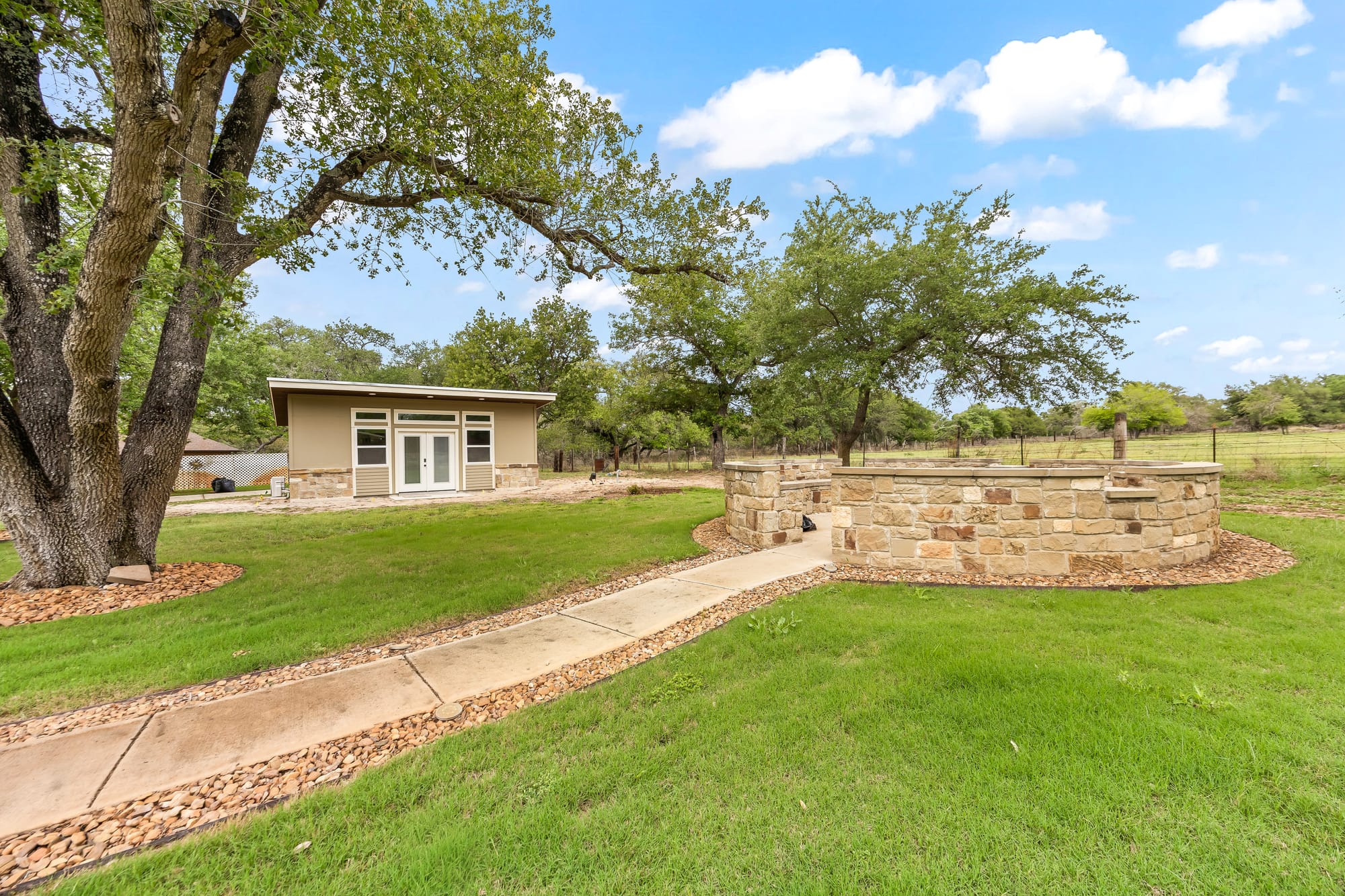 Exterior with stone wall and yard