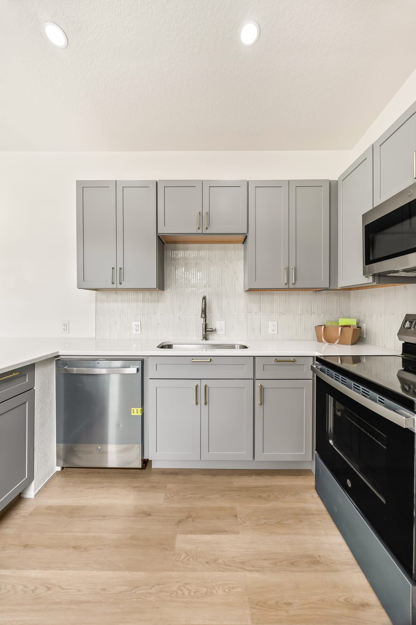 Kitchen with gray cabinetry in the custom Classic kit