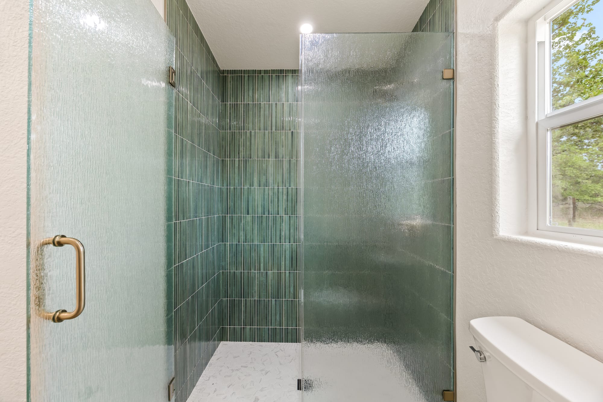 Shower with glass enclosure